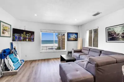 a living room with a couch and a table at Beach Front 1 Bedroom with Ocean View, Pool and Parking in Hollywood