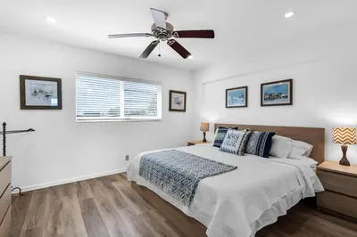 a bedroom with a bed and a ceiling fan at Beach Front 1 Bedroom with Ocean View, Pool and Parking in Hollywood
