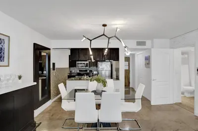 a dining room and kitchen with a table and chairs at Superb Private unit Perfectly Located In Brickell in Miami