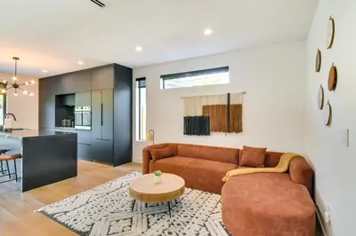a living room with a couch and a table at Modern Miami Home with Pool 1 Mi to Design District! in Miami