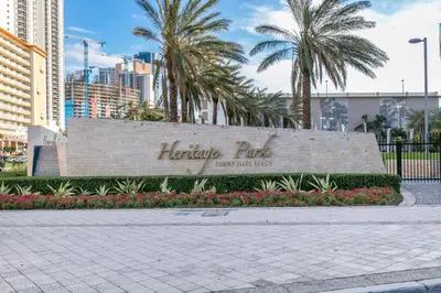 a sign for the harrisburg gulf with palm trees at Spacious Family Escape with Pool & Beach Access in Sunny Isles Beach