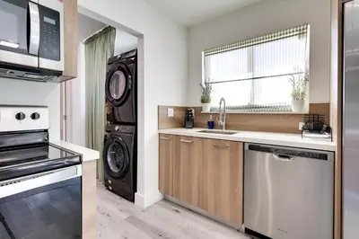 a kitchen with a sink and a dishwasher at Spacious and Serene Miami Home Walk to Metrorail! in Miami