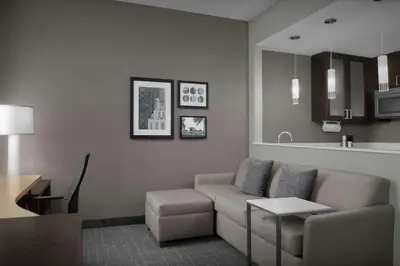 a living room with a couch and a table at Residence Inn by Marriott Fort Lauderdale Airport & Cruise Port in Dania Beach