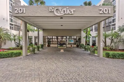 a entrance to a building with a sign that reads enter at Le Cartier Sunny Isles Ocean Paradise in Sunny Isles Beach