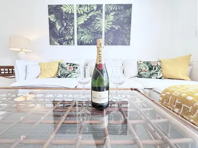 a bottle of wine on a coffee table in a living room at Le Cartier Sunny Isles Ocean Paradise in Sunny Isles Beach