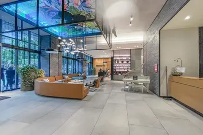 a lobby with a couch and a table in a building at Unwind in Your Amazing City View Apartment in Miami