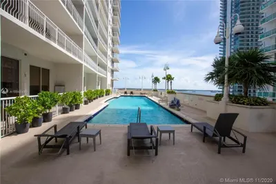 a swimming pool in the middle of a building at Miami Brickell 3 Bedrooms high ceiling loft in Miami