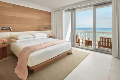a bedroom with a bed with a view of the ocean at The Miami Beach EDITION in Miami Beach