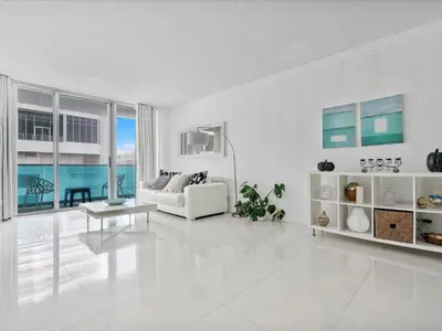 a white living room with a couch and a table at Ocean View 1 bed Sian 11th floor Miami in Hollywood