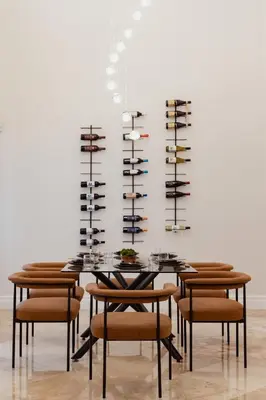 a dining room with a table with chairs and wine racks at Miami Getaway Heated Pool Villa with Mini Golf & BBQ in Miami