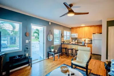 a kitchen and living room with a ceiling fan at Vistamar Waterfront Beach Abode -Walk to the Beach in Fort Lauderdale