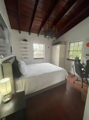 a bedroom with a bed and a desk with a chair at Villa Rustica 5 Bedroom 3 Bath with Pool Next to River 1800 in Miami