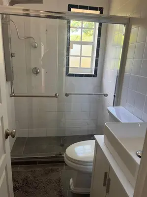a bathroom with a shower and a toilet and a sink at Villa Rustica 5 Bedroom 3 Bath with Pool Next to River 1800 in Miami