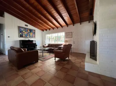 a living room with couches and chairs and a fireplace at Villa Rustica 5 Bedroom 3 Bath with Pool Next to River 1800 in Miami