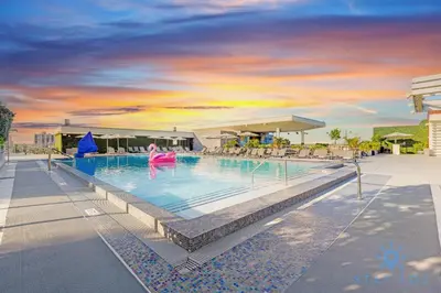 a pool at a resort with a person in the water at New Studio - Hollywood Beach Bliss for 2 in Hollywood