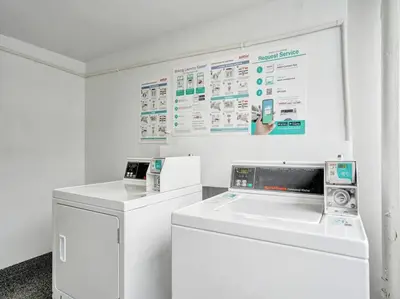 a white laundry room with a washer and dryer at Beautiful Beach Condo Beach Service 1020 in Miami Beach