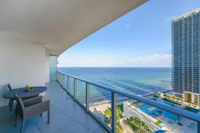 a balcony with a view of the ocean at Beachside Condo with a Mesmerizing Ocean View in Hollywood