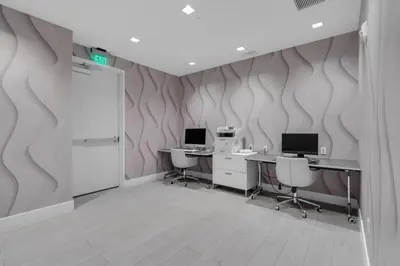 an office with two desks and two computers at Modern 1 Bedroom In The Heart Of Downtown Doral in Hialeah Gardens