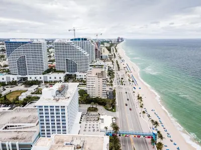 an aerial view of a beach with buildings and the ocean at Bayshore Breeze Free Parking 1 in Fort Lauderdale