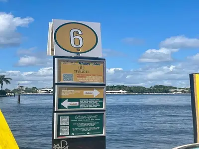 a sign in front of a body of water at Bayshore Breeze Free Parking 3 in Fort Lauderdale