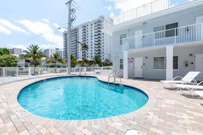 a swimming pool in front of a building at Bayshore Breeze 4 in Fort Lauderdale