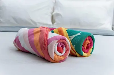 a colorful towel is laying on a bed at Bayshore Breeze 8 in Fort Lauderdale