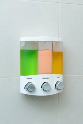 a soap dispenser hanging on a wall at Bayshore Breeze Free Parking 9 in Fort Lauderdale