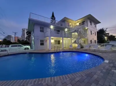 a large swimming pool in front of a house at Bayshore Breeze 10 in Fort Lauderdale