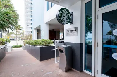 a restaurant with a sign on the side of a building at Ocean Breeze Free Parking Apt 2 in Fort Lauderdale
