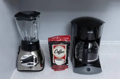 a coffee maker and a blender on a counter at Short Walk to Wilton Drive Apt2 in Fort Lauderdale