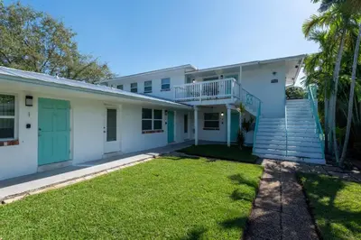 a house with a staircase and a yard at Short Walk to Wilton Drive Apt2 in Fort Lauderdale