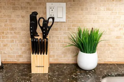 a couple of knives on a counter next to a plant at Short Walk to Wilton Drive Apt3 in Fort Lauderdale
