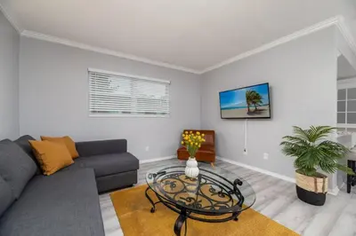 a living room with a couch and a table at Short Walk to Wilton Drive Apt4 in Fort Lauderdale