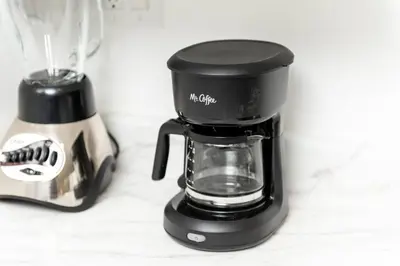 a black coffee maker sitting on a counter at Just Off Wilton Drive Apt 2 in Fort Lauderdale