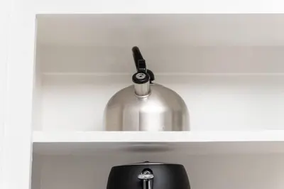 a metal container sitting on top of a shelf at Just Off Wilton Drive Apt 3 in Fort Lauderdale