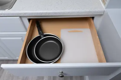 a frying pan in a drawer of a kitchen counter at Just Off Wilton Drive Apt 8 in Fort Lauderdale