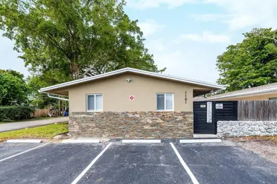 a house with a parking lot in front of it at Comfy Condos at Middle River Apt 2 in Fort Lauderdale