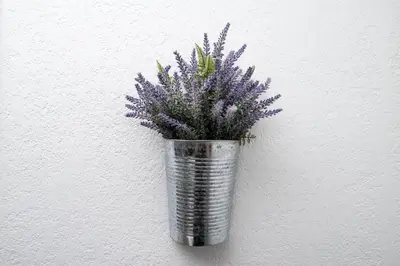 a vase filled with purple flowers on a wall at Comfy Condos at Middle River Apt 2 in Fort Lauderdale