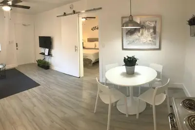 a living room with a white table and chairs at Comfy Condos at Middle River Apt 3 in Fort Lauderdale