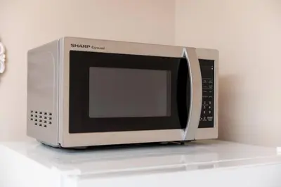 a microwave sitting on top of a counter at The Residences at Lake Ridge Apt 2 in Fort Lauderdale