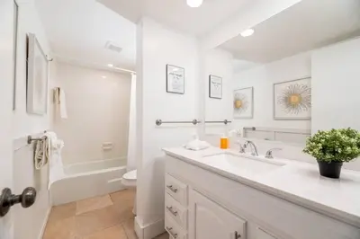 a white bathroom with a sink and a toilet at The Residences at Lake Ridge Apt 2 in Fort Lauderdale