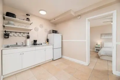 a kitchen with a sink and a refrigerator at The Residences at Lake Ridge Apt 2 in Fort Lauderdale