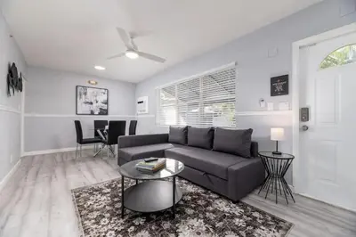 a living room with a couch and a table at The Residences at Lake Ridge Apt 3 in Fort Lauderdale