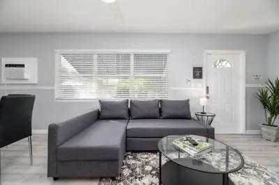 a living room with a couch and a glass table at The Residences at Lake Ridge Apt 3 in Fort Lauderdale