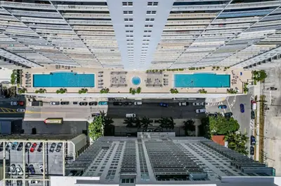 a view of a large building with a pool at Luxe Brickell Gem with Huge Balcony n Ocean Views in Miami