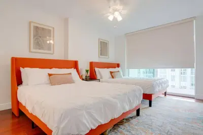 a bedroom with two beds and a window at Stylish 1BR APT with Ocean and City view,pool,parking in Miami