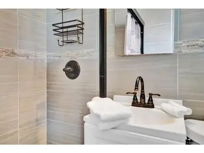 a bathroom with a sink and a shower at Chic Studio Apartment in Hollywood Beach in Hollywood