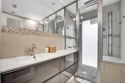 a bathroom with a sink and a shower at Beach Isles Modern 1BR Waterfront Apartment with Patio in Fort Lauderdale
