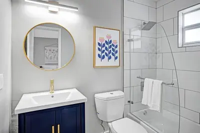 a bathroom with a sink and a toilet and a mirror at Rustic Retreats Beachy 1BR for 4 guests in the heart of Fort Lauderdale in Fort Lauderdale