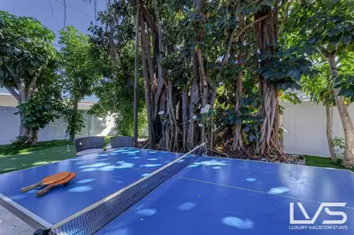a blue table with a pair of scissors on it at Cascada-Luxe Resort Heated Pool HotTub Wlk 2 Beach in Fort Lauderdale